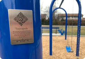 put-qrcode-timecapsule-anywhere timecapsule qr code plaque on playground swings