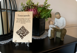 qrplaque-on-mantle-wood wood grain qr code plaque on mantle